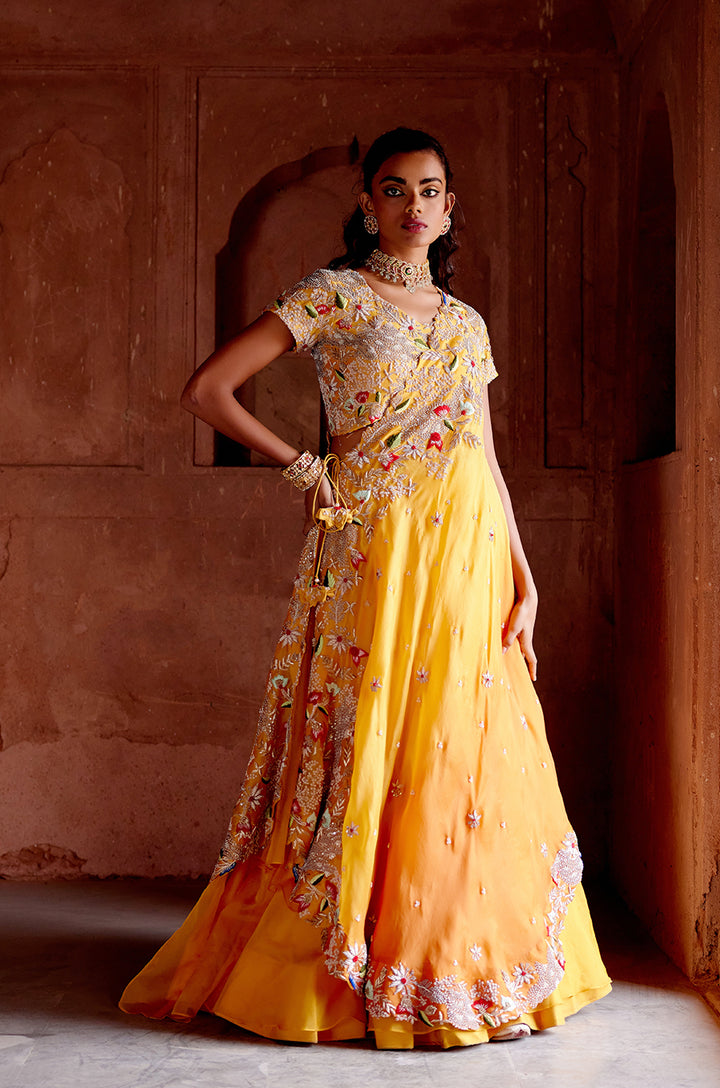 SIGNATURE CROSS DRAPE LEHENGA  SET WITH HEAVY EMBROIDERED BLOUSE & DOUBLE LAYERED SKIRT